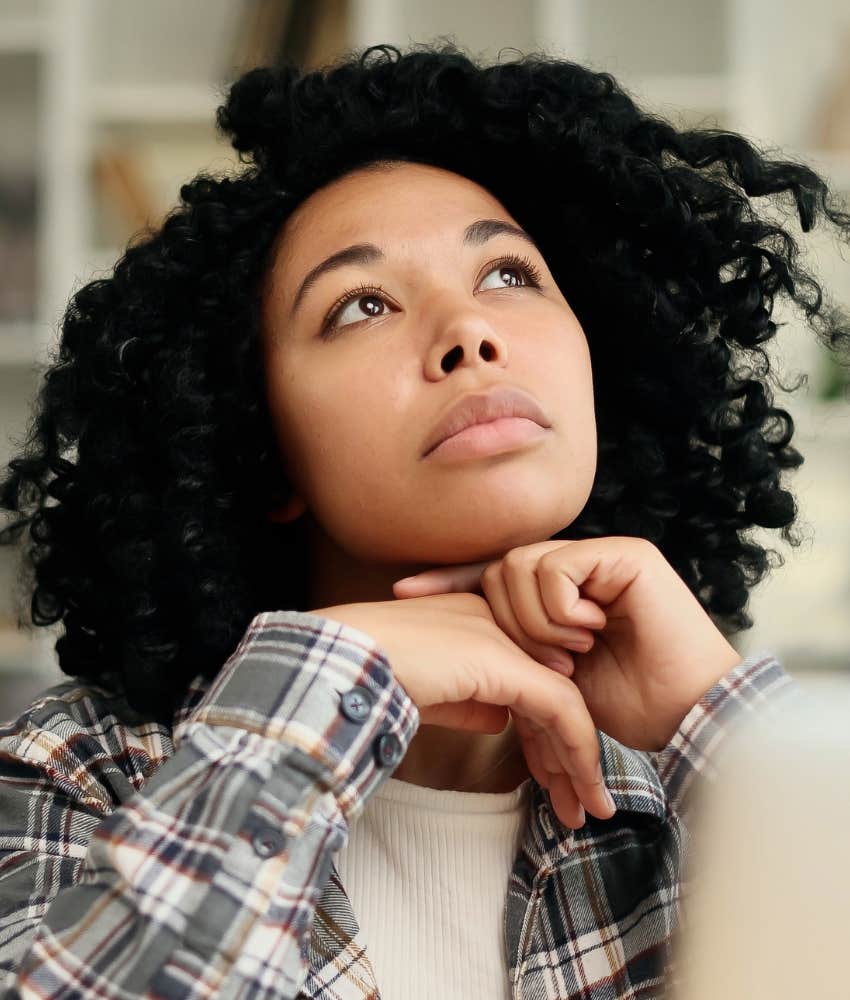 Contemplative person looks up showing new perspective heals heartbreak