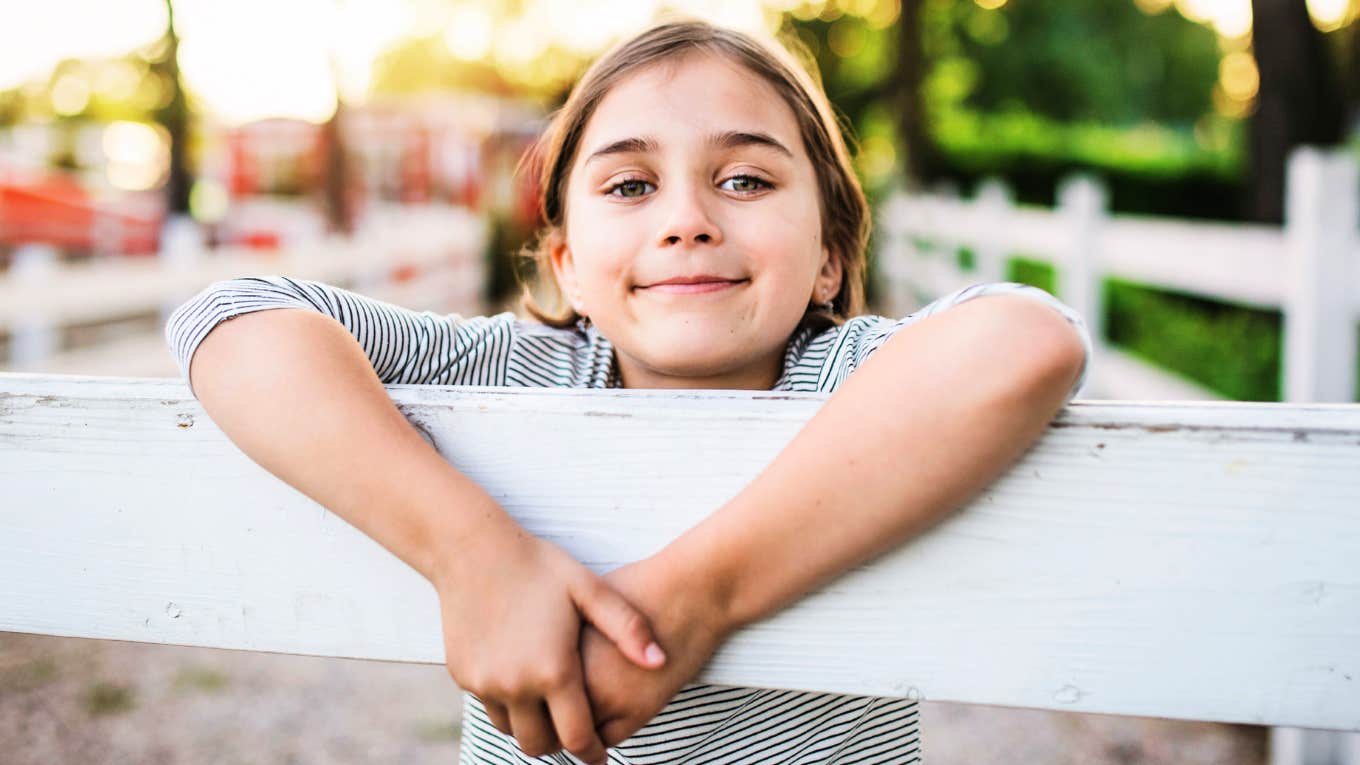 emotionally aware child showing kindness and thoughtful behavior in a small everyday moment, illustrating the simple signs of above-average emotional intelligence