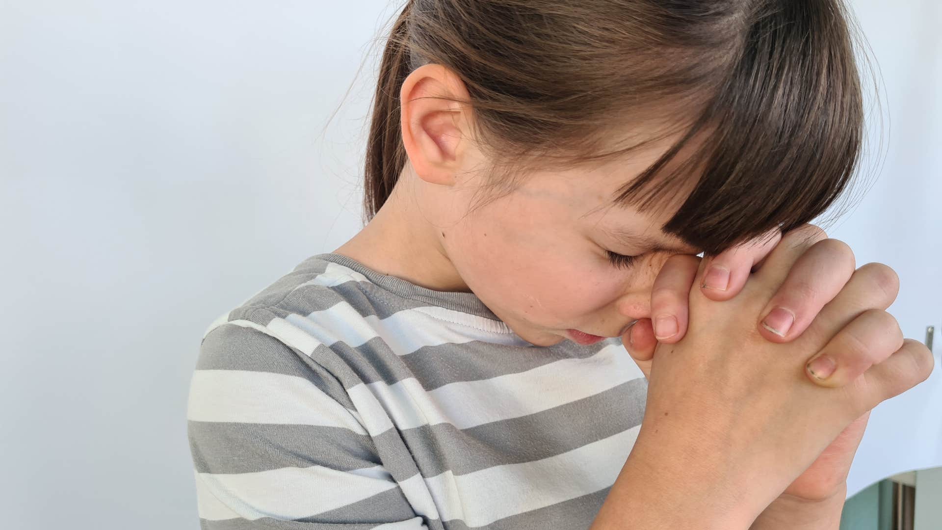 child who has above-average intelligence as she practices gratitude
