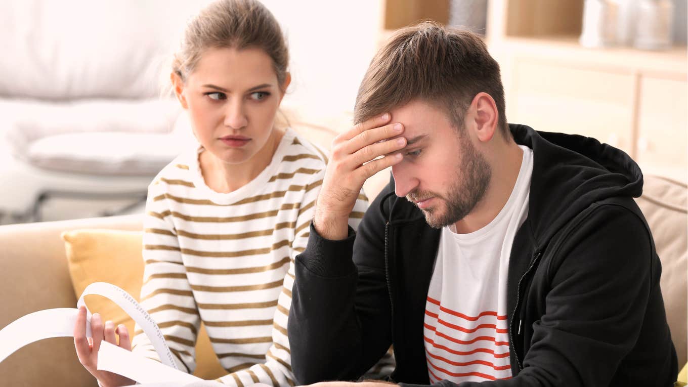 stressed couple arguing about spending habits, capturing the subtle everyday behaviors that reveal early signs of money trouble
