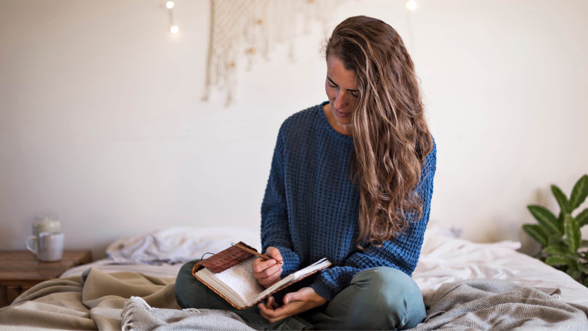 woman with psychic intelligence as she keeps a dream journal