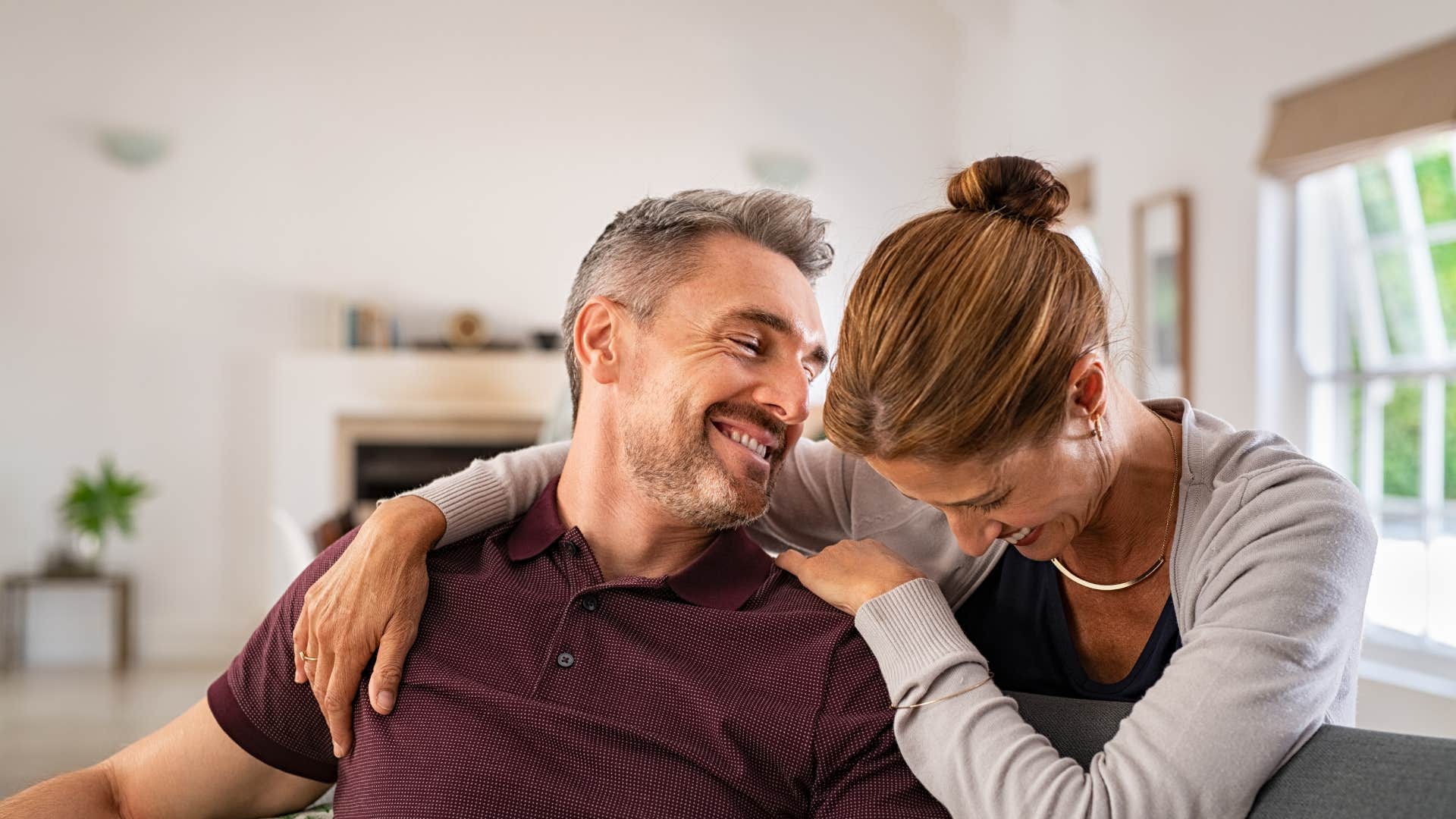 man who makes woman laugh by playing into his strengths