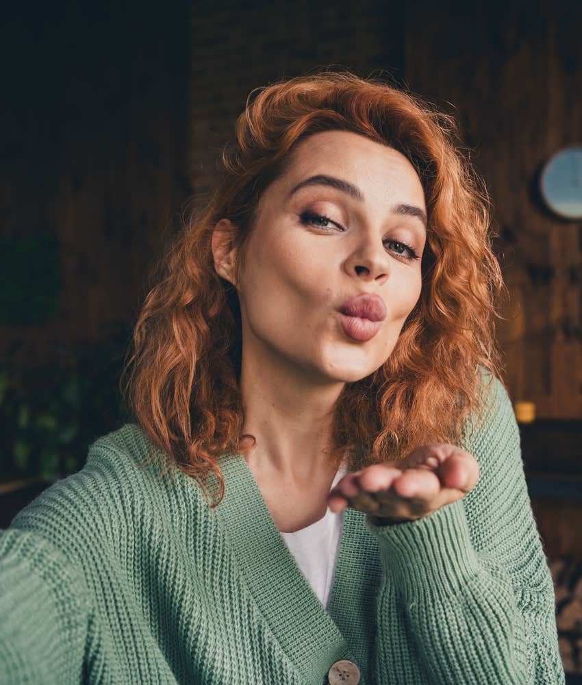 Woman blows kiss to camera showing mindset shift to have it all including love