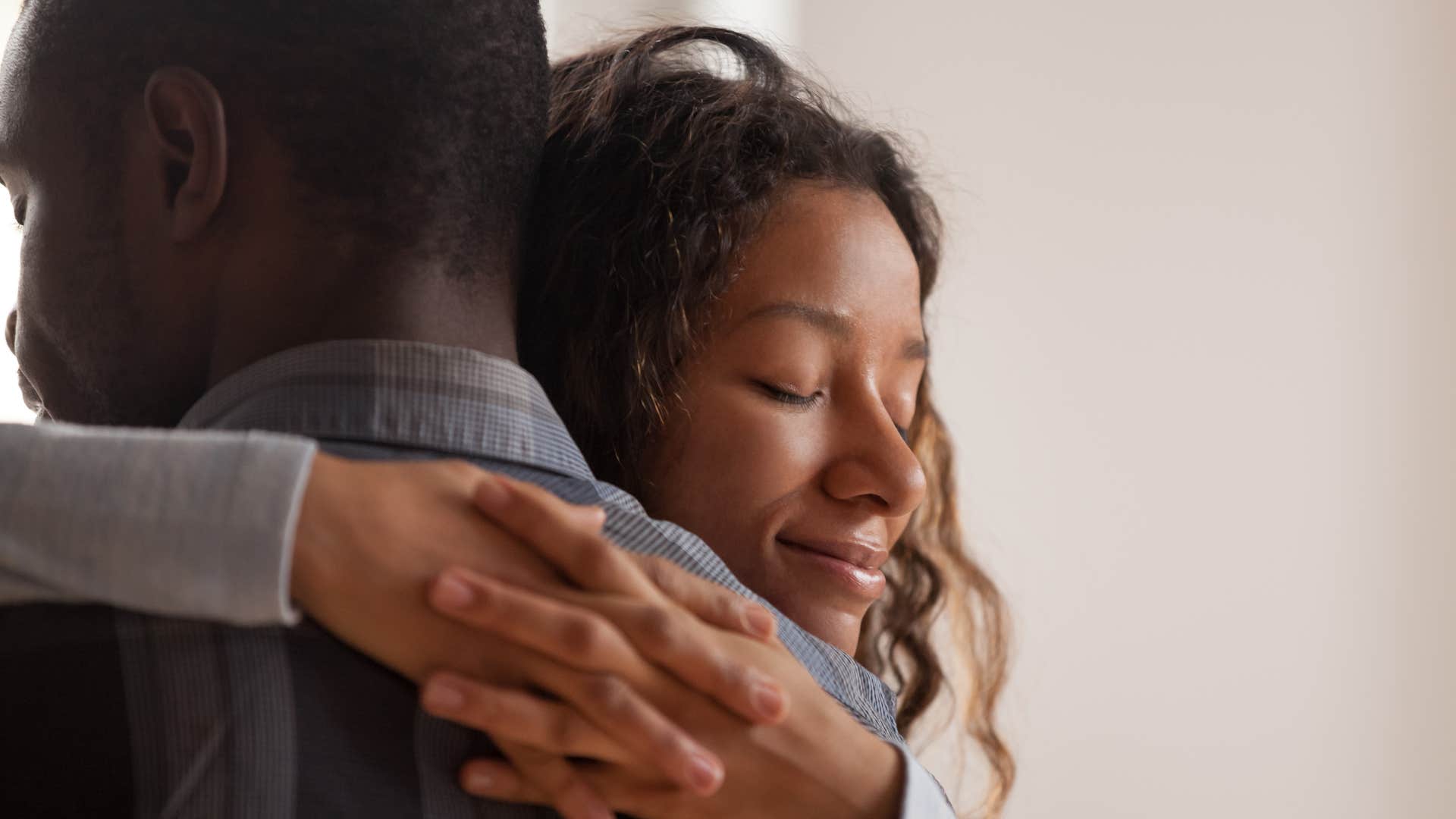 Guilt-free person hugs partner with kindness