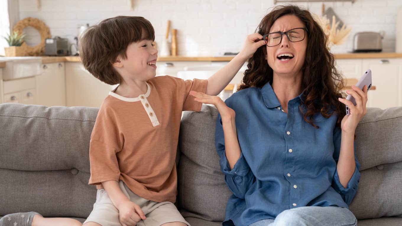 kid annoying his mom