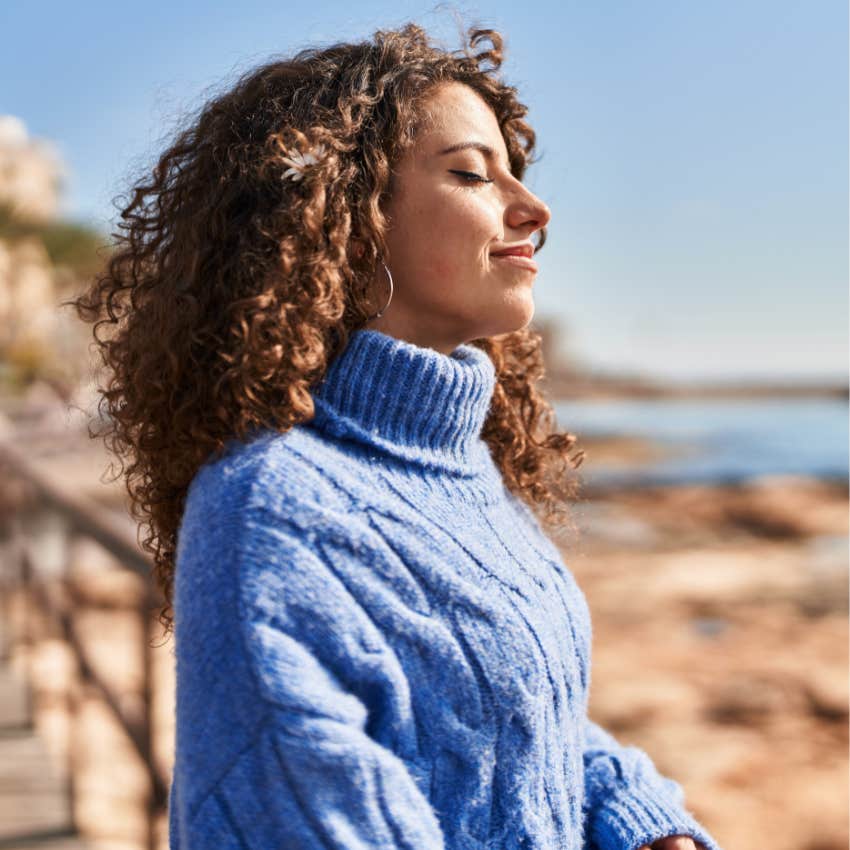 woman who wants to feel happier this holiday by following the signs life is giving her