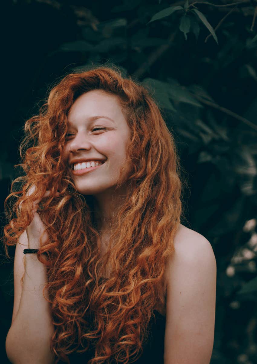 smiling young woman with ginger hair