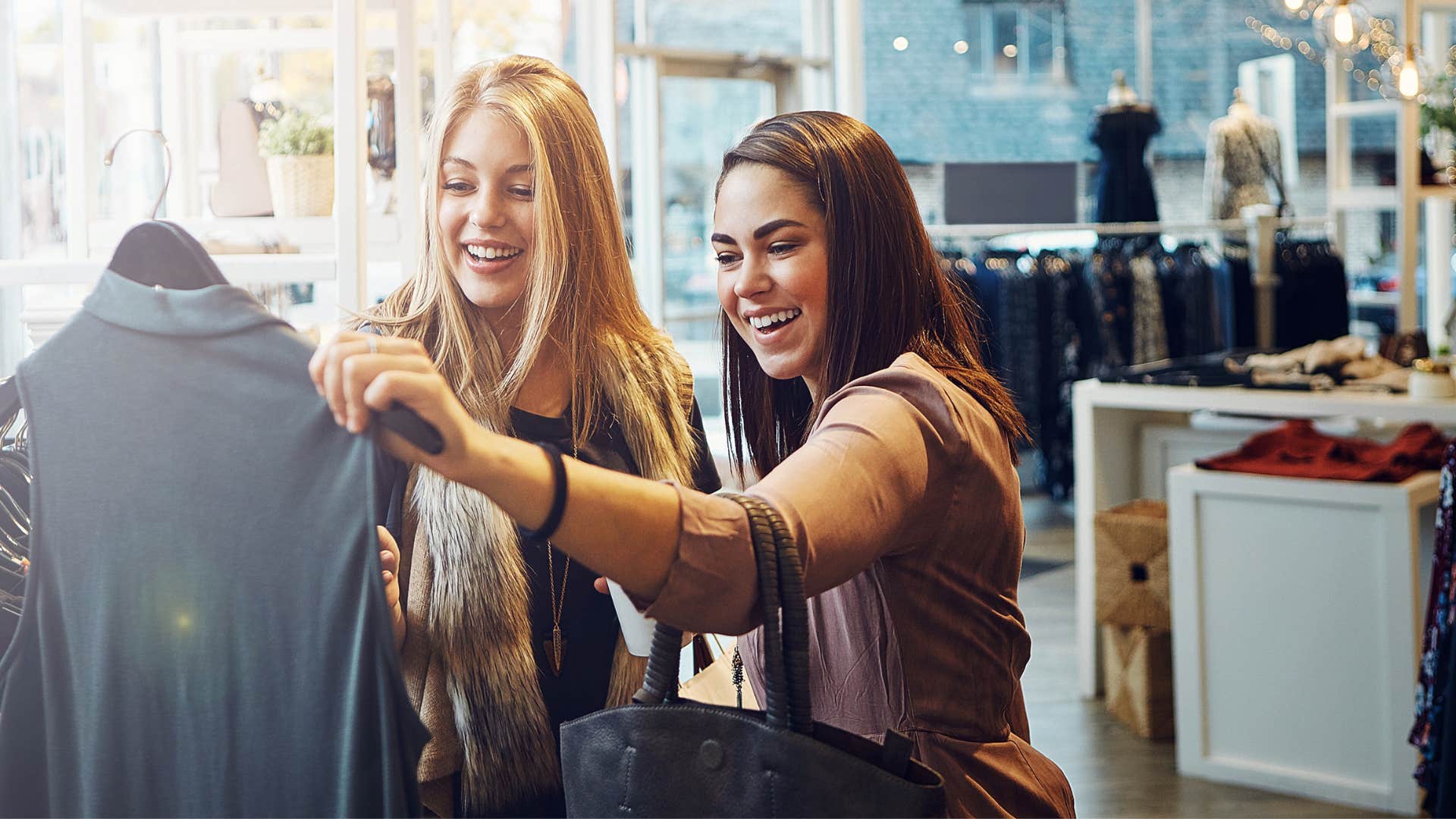 woman picking out clothes together as they say i deserve this