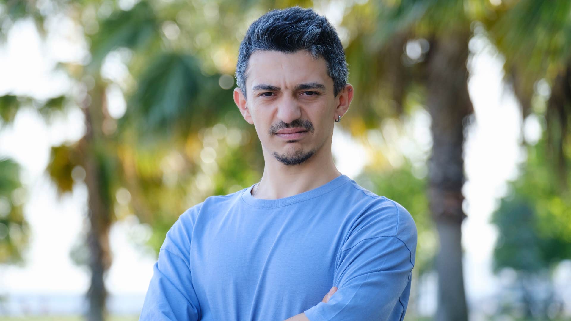 man in blue looking disgusted as he thinks that's beneath me