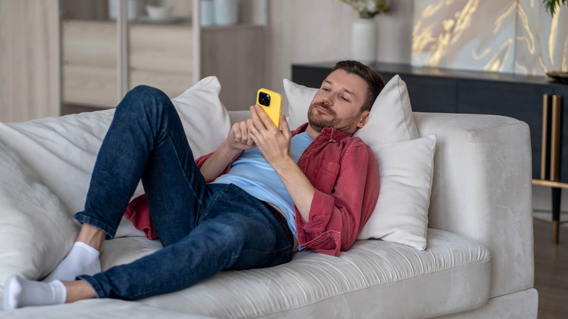 lazy loser man on the couch procrastinating saying i'll do it another time