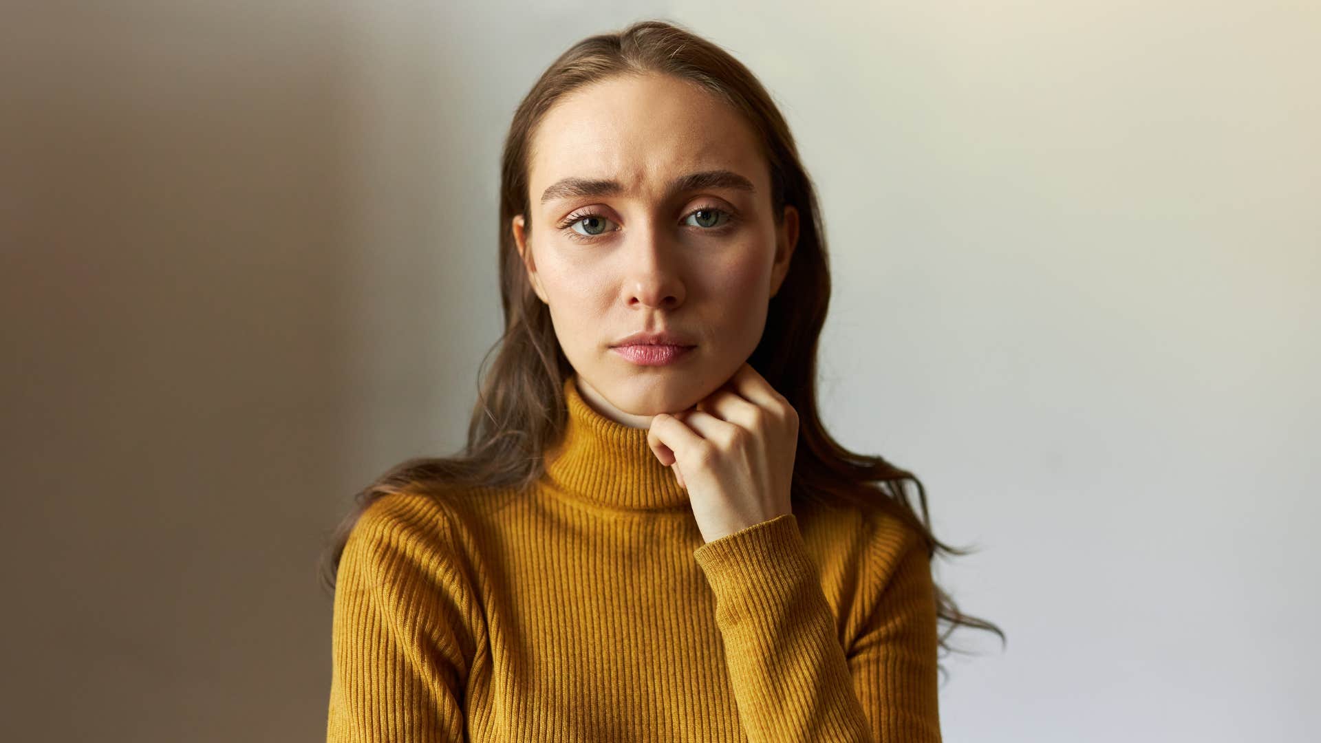 serious woman thinking she has horrible luck