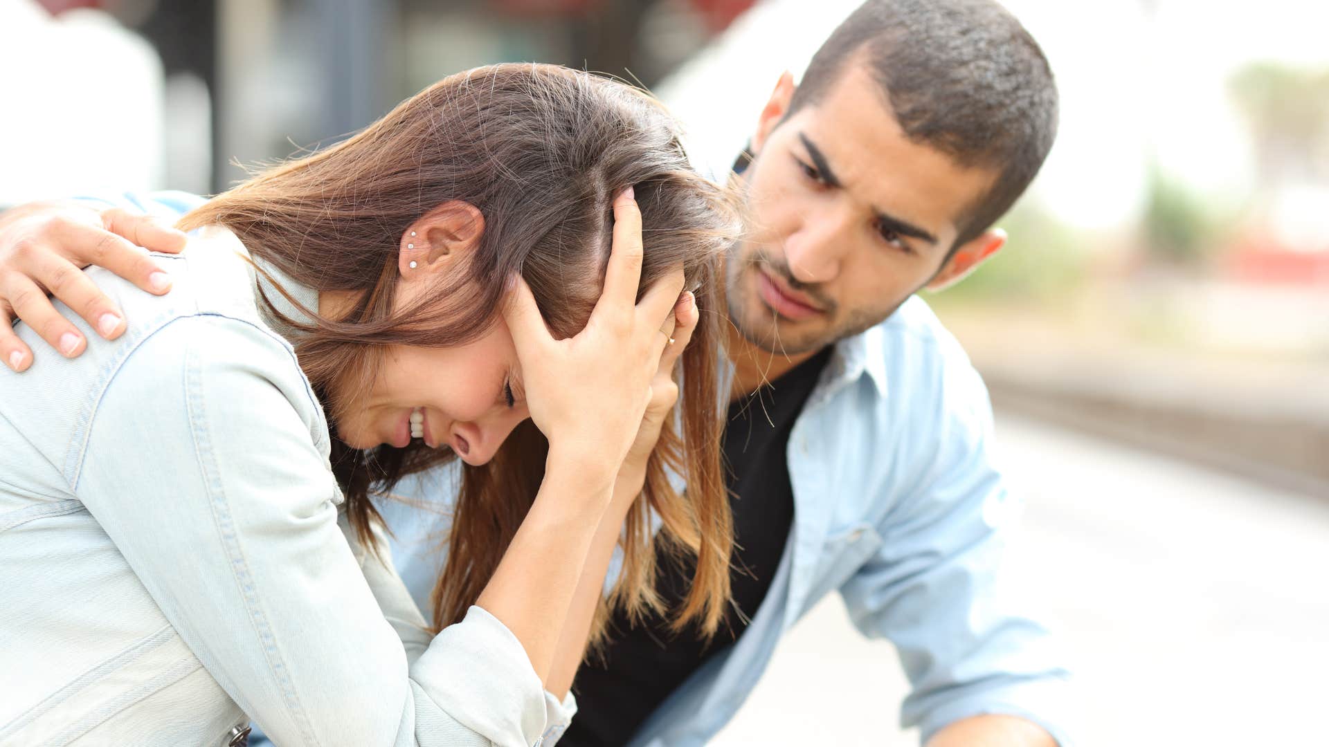 woman crying saying she tries so hard to man