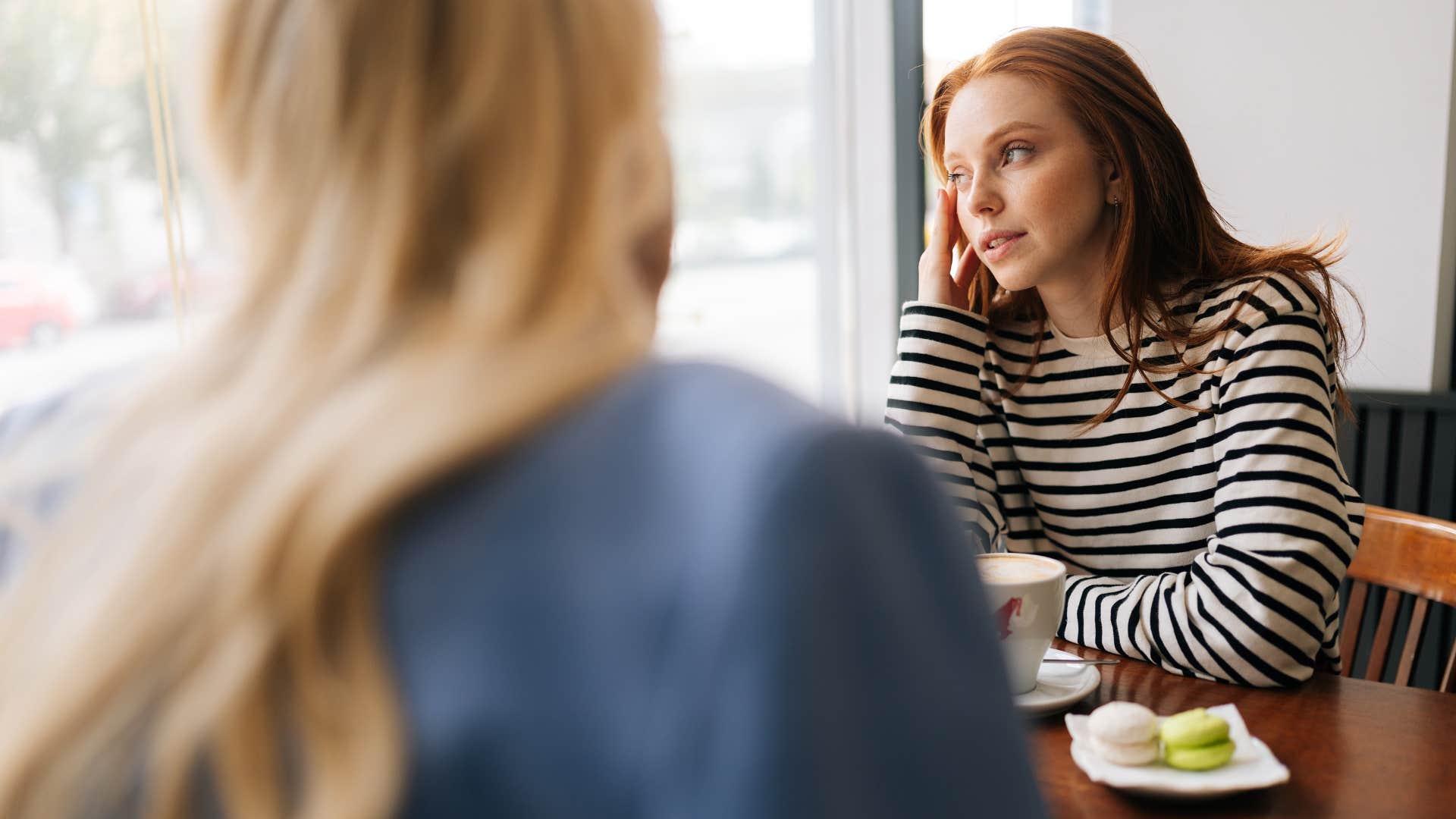 sad friend telling woman not to worry about it