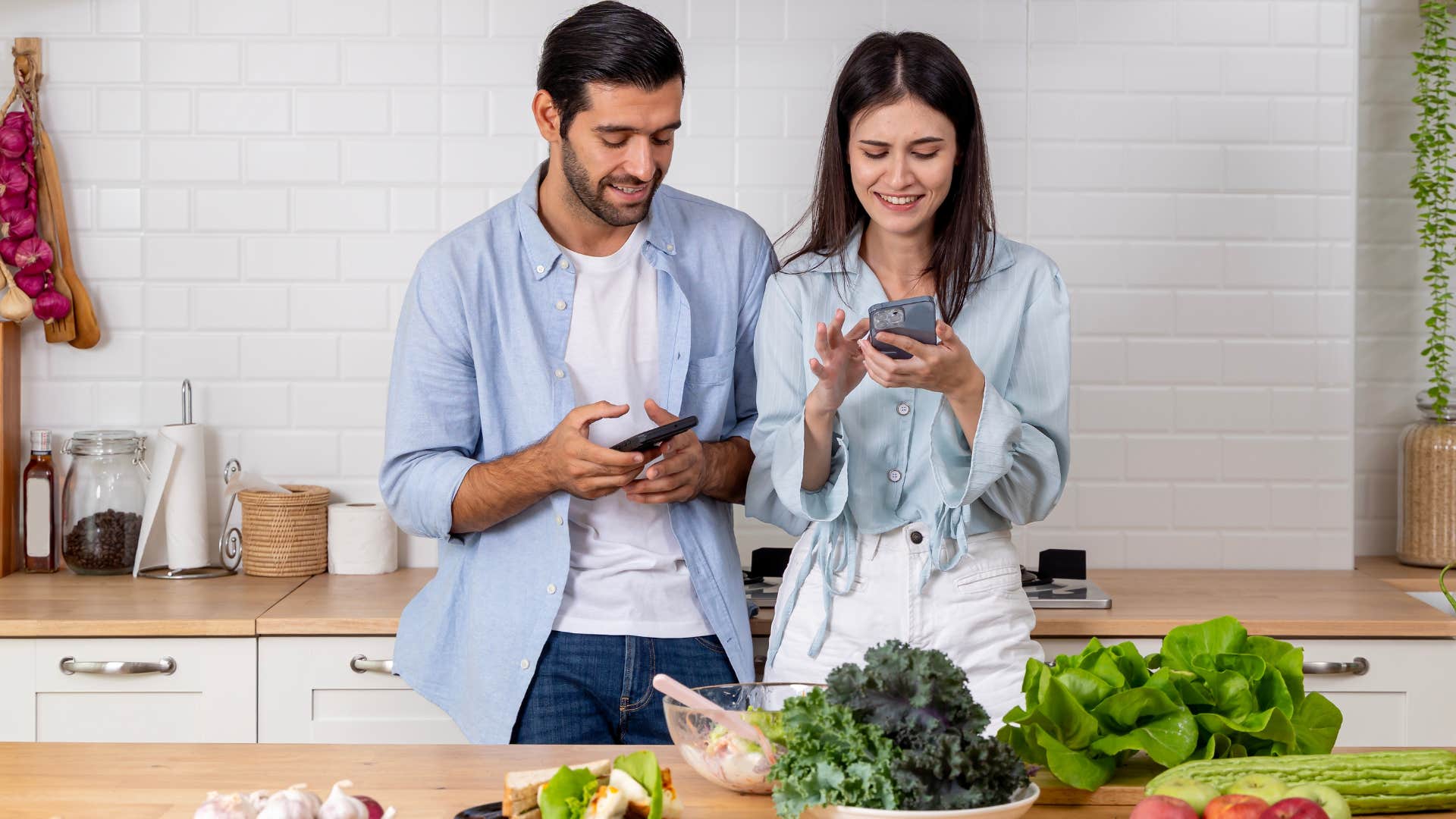 couple standing at a kitchen island at home