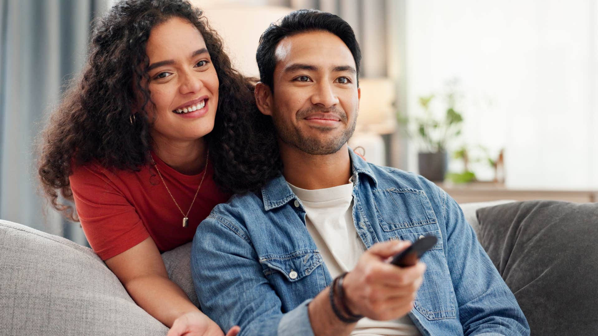 couple watching TV subscriptions at home