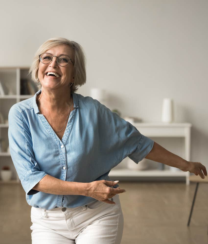 Joyful woman dancing showing habit never lose spark