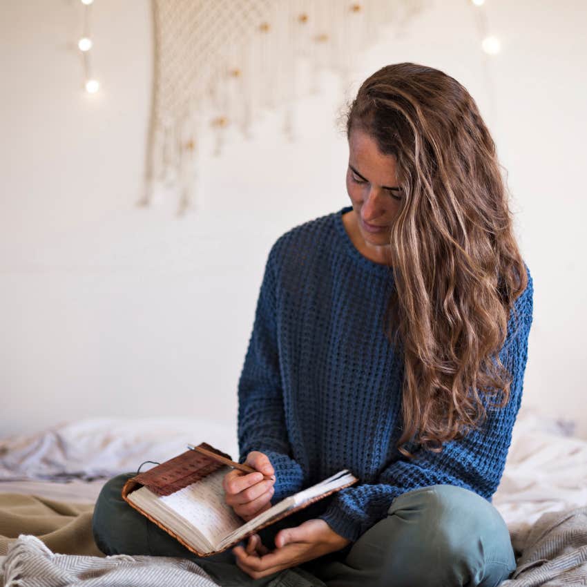 woman keeping it together after a breakup by writing a new story