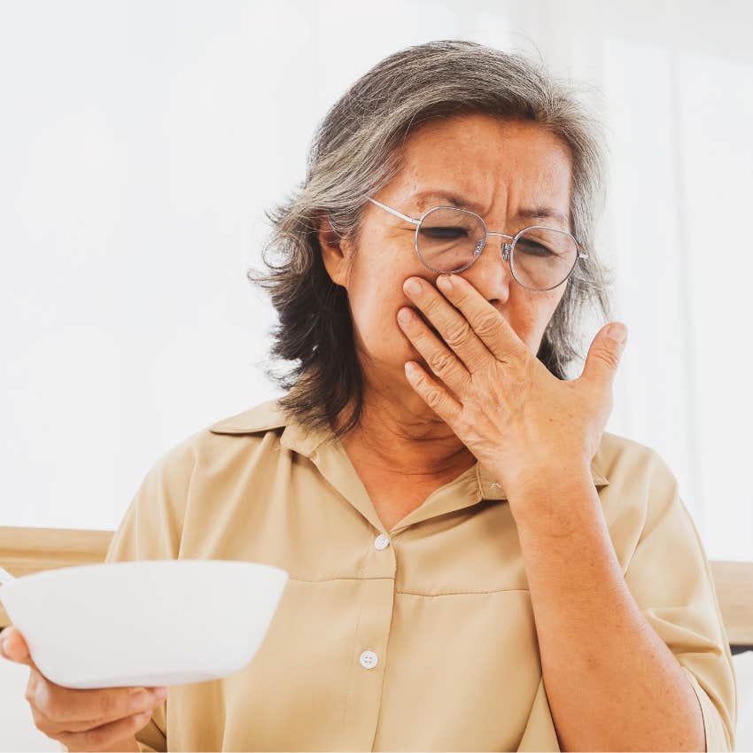 stressed woman whose appetite is changing turning away from food