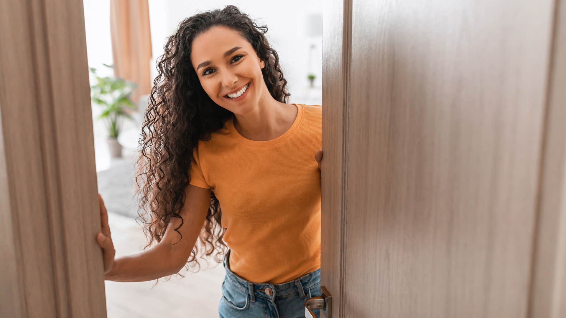 woman opening door for someone