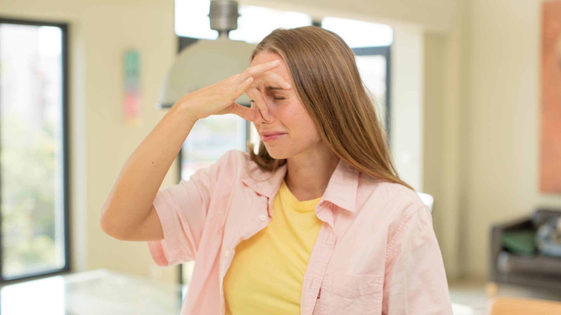disgusted woman covering her nose
