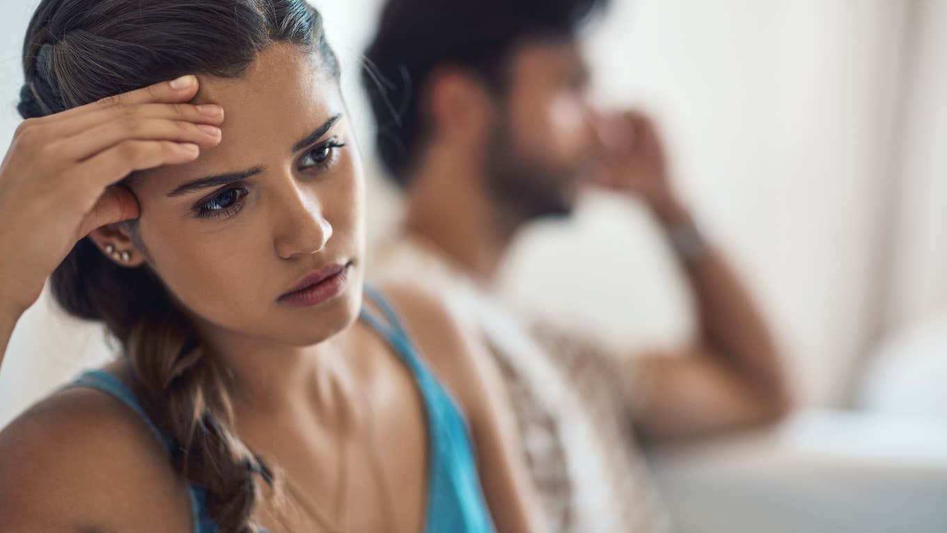 unhappy couple sitting beside each other after argument