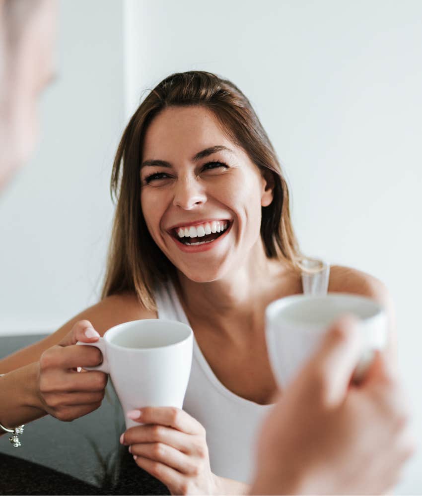 Successful woman laughing with a friend staying true to herself 