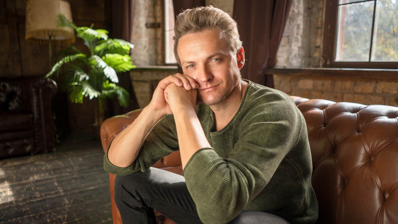 wealthy man with tacky behaviors sitting at home