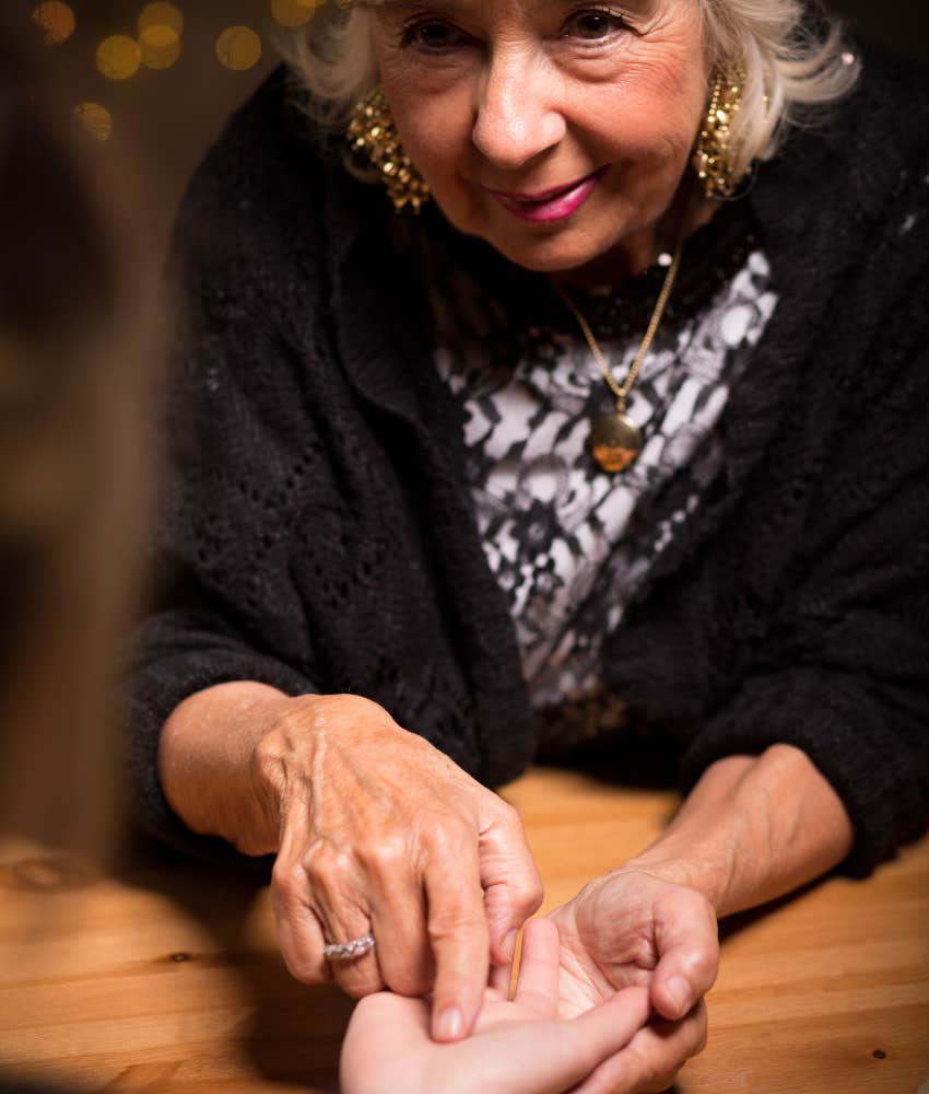 palm reader determining if someone is a cheater by looking at their hand