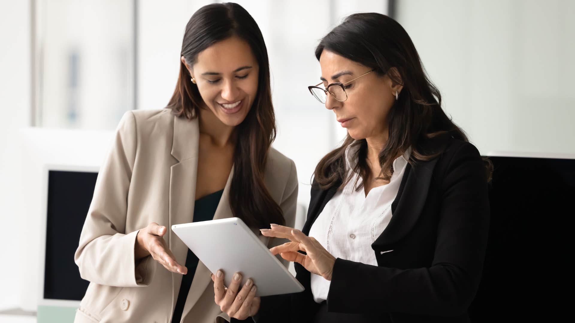 woman asking colleague for help