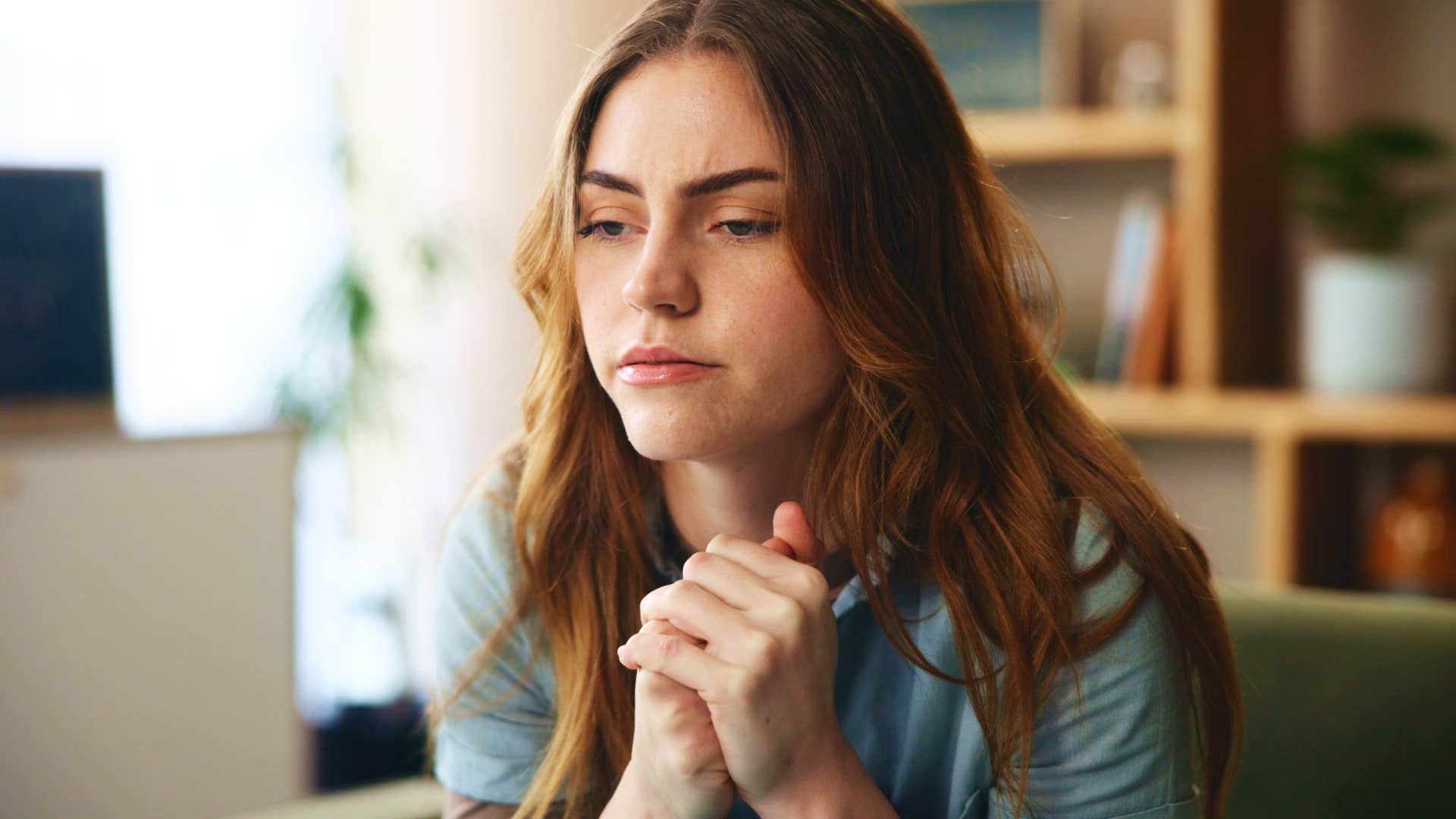 pensive woman realizing some relationships aren't worth her energy