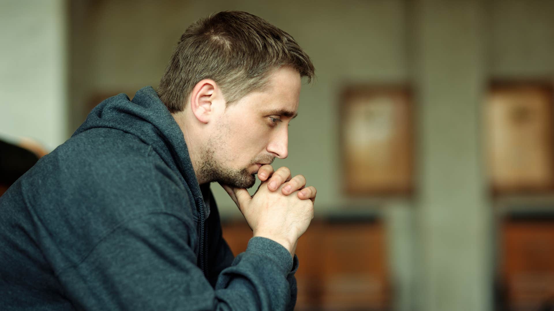 sad man reflecting on his feelings 