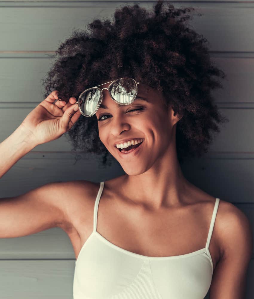 Woman winks at ex because she wants ex to want her again 