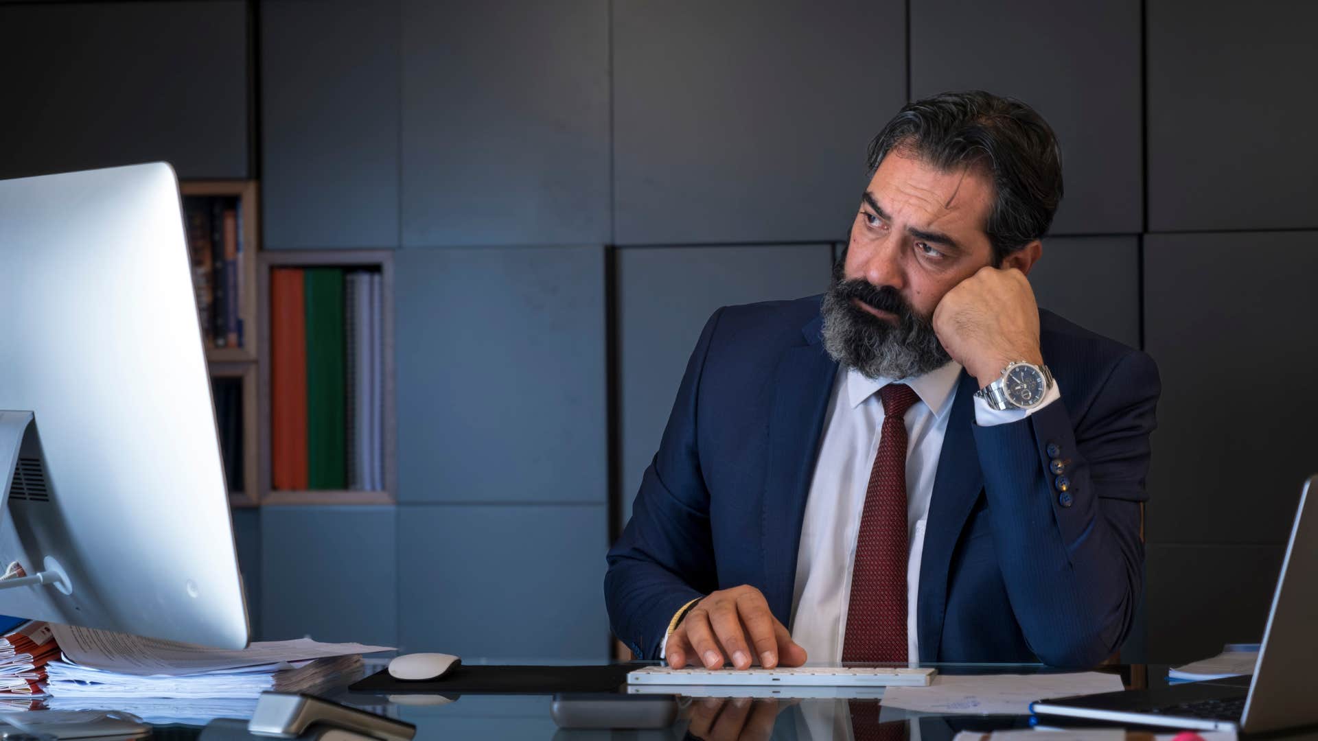 man at work getting easily bored