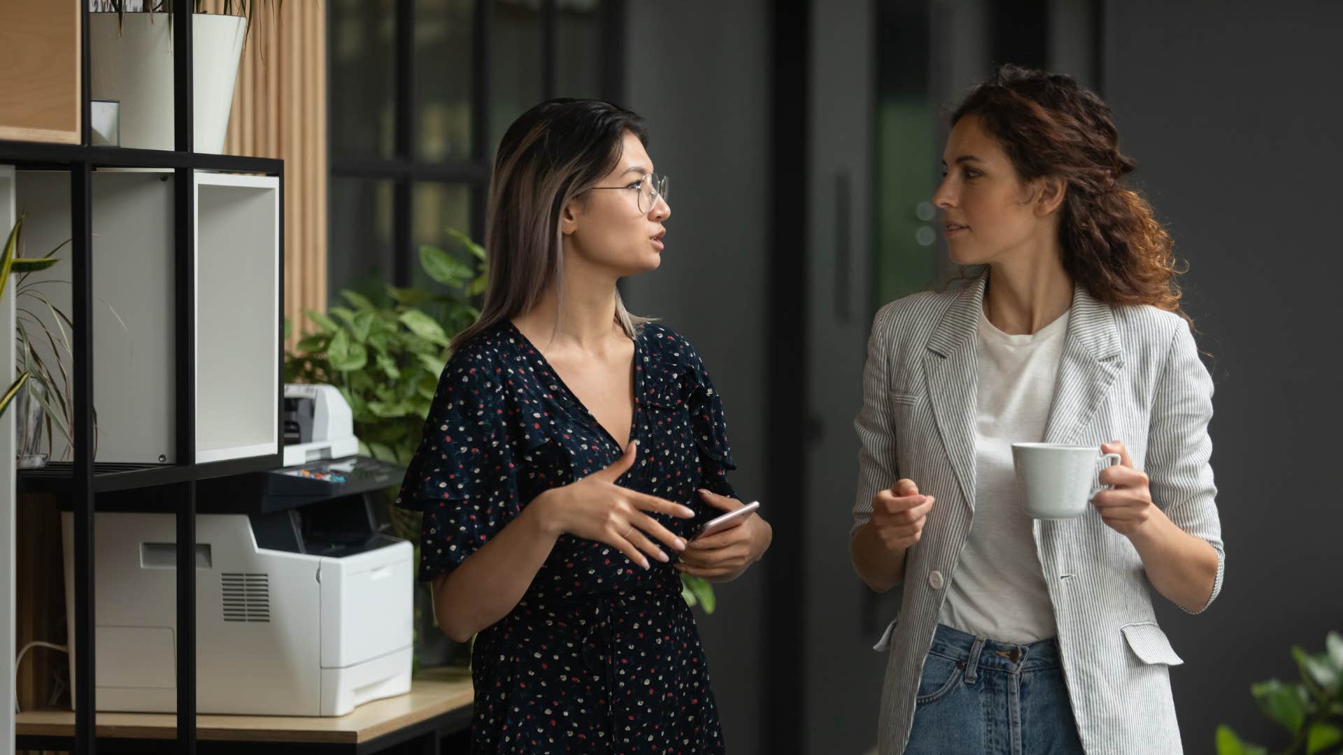 two women talking learning from each other's mistakes at work