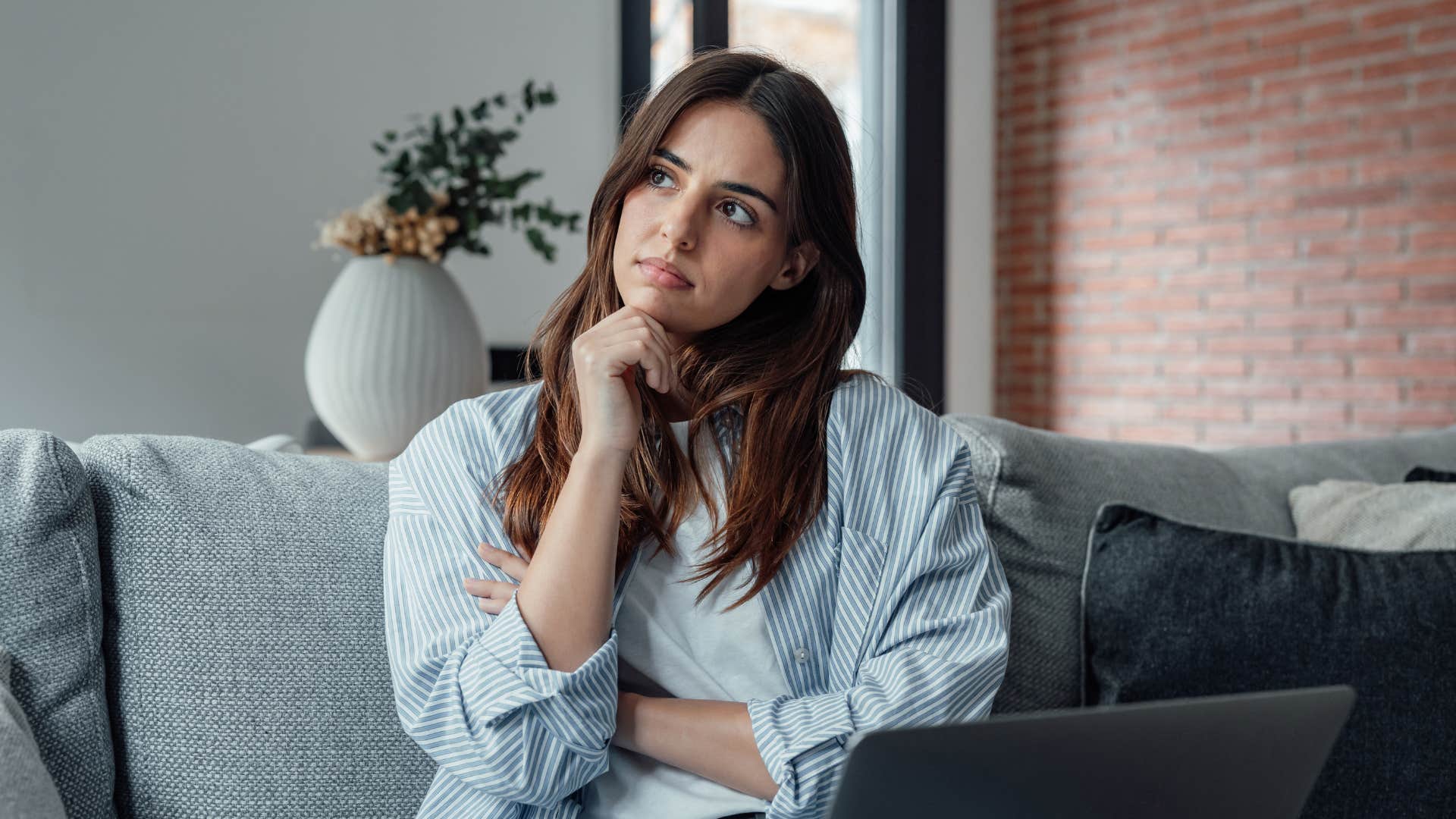 intelligent woman at home questioning everything