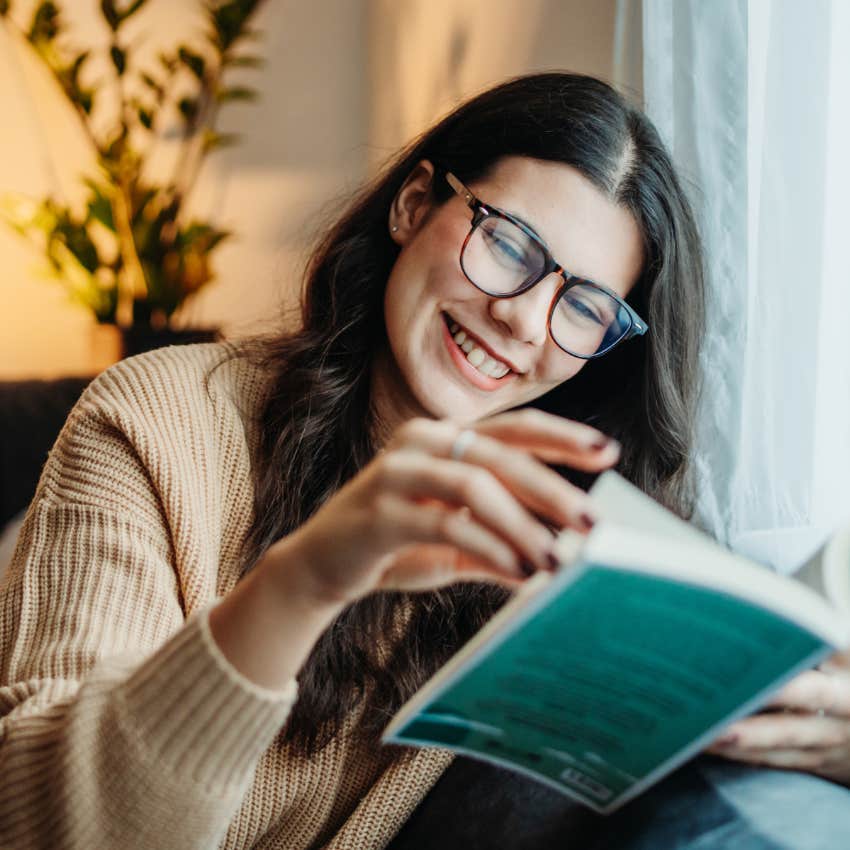 Woman who leans into challenge reading in the morning.