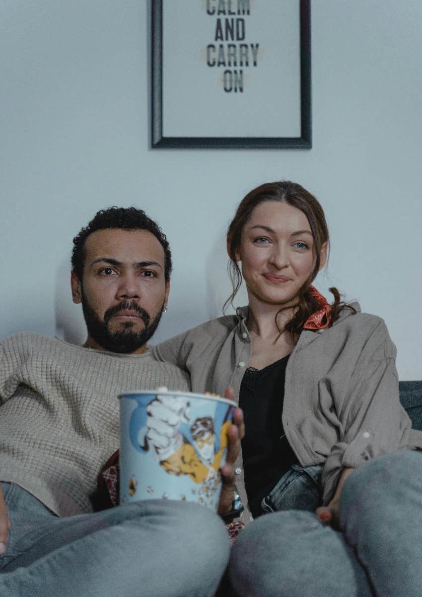 couple watching movie together at home