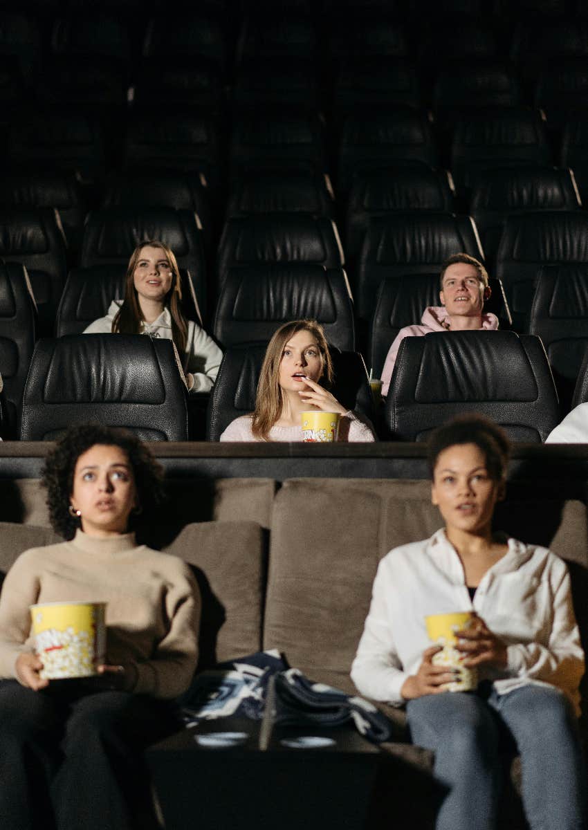 people watching a movie at the theater