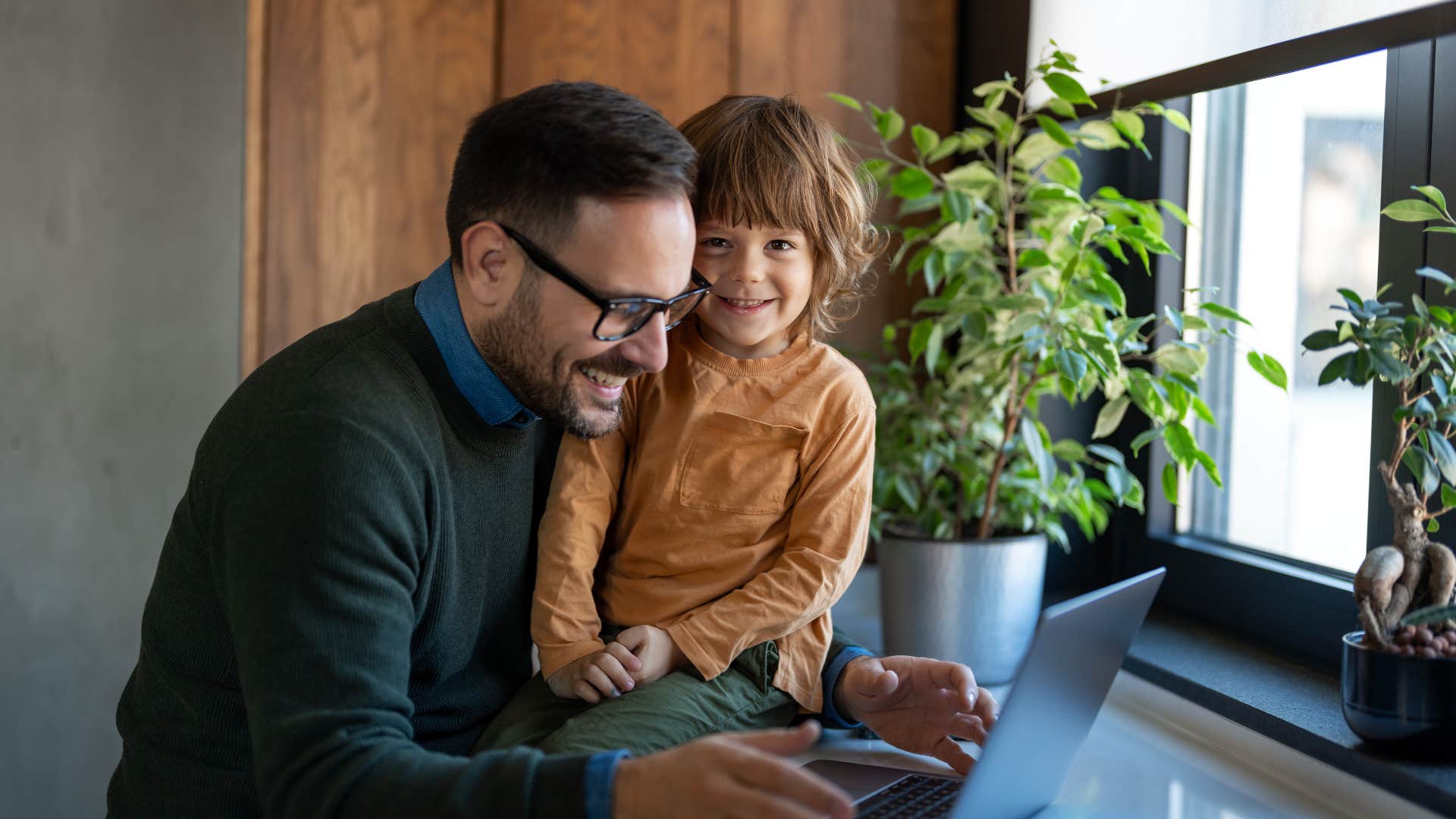 dad spending time with smiling son 