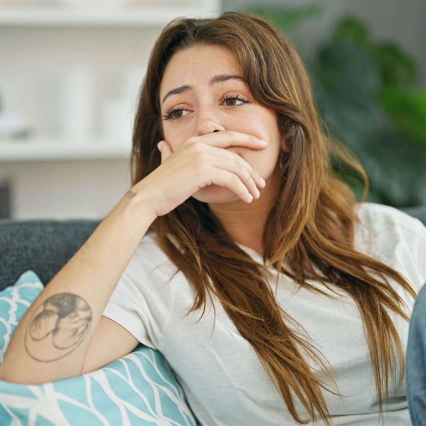 woman who knows that comfort isn't always a bad thing sitting at home