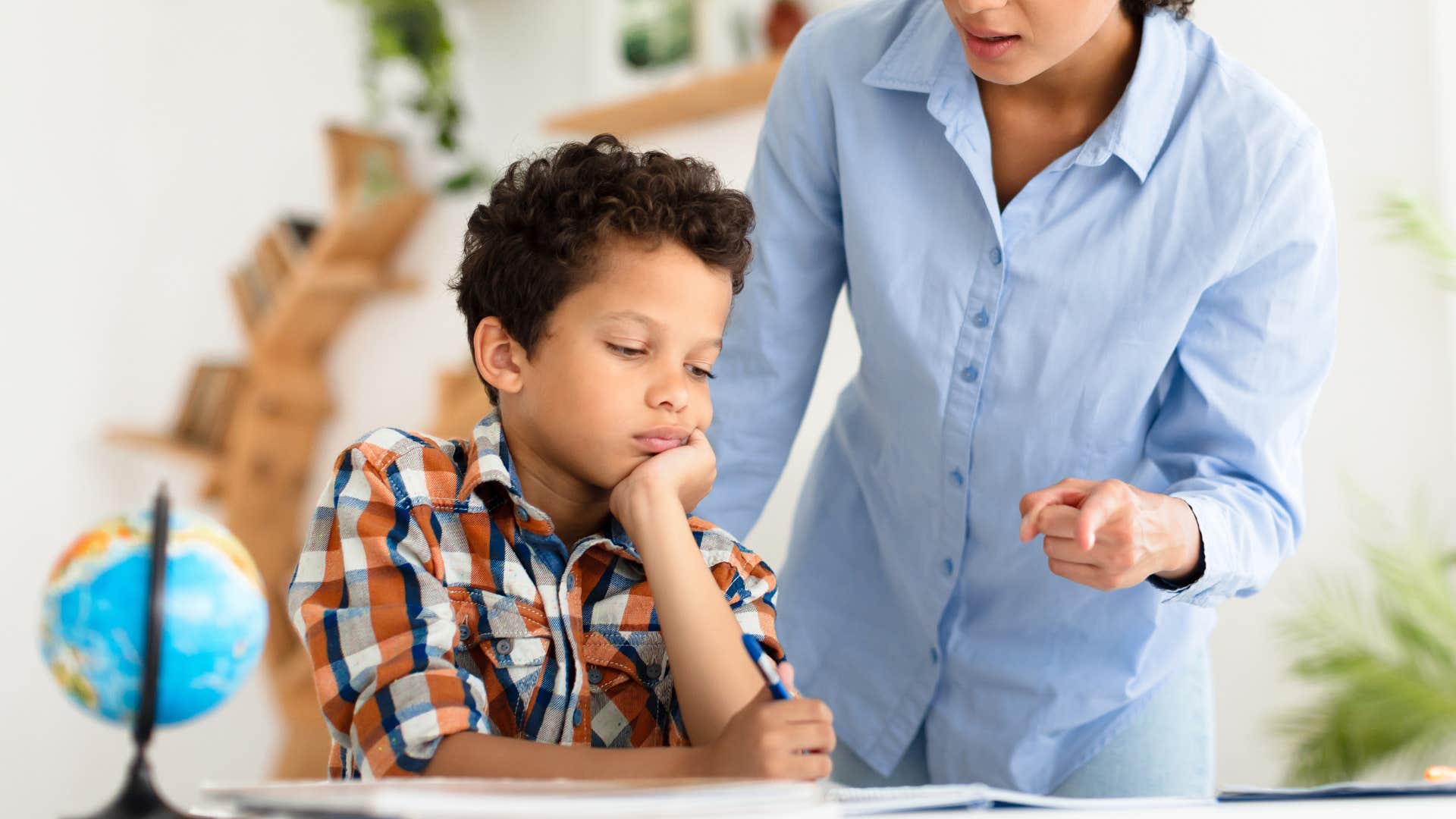 teacher disciplining her student