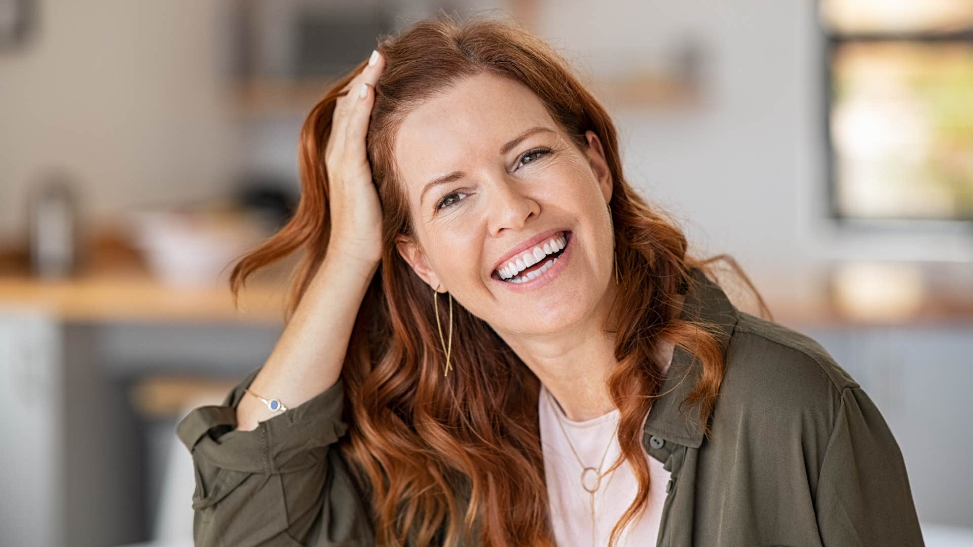 woman laughing at herself smiling
