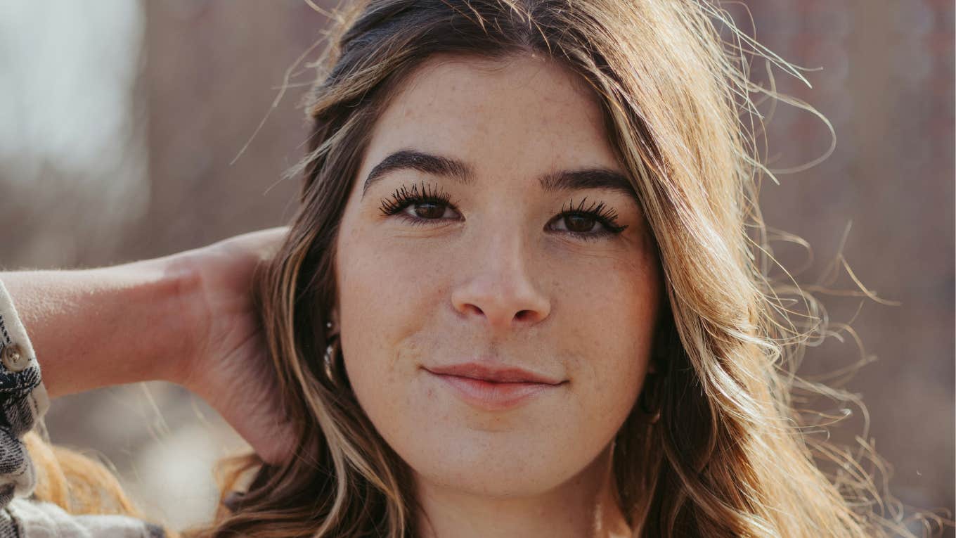 Woman is unbothered and protected from bad vibes.