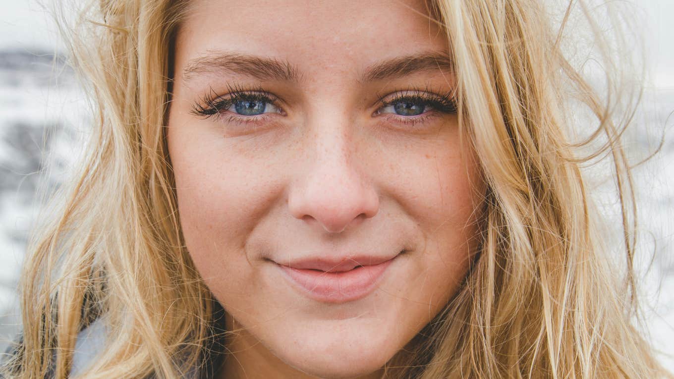 Woman is unbothered and happy.