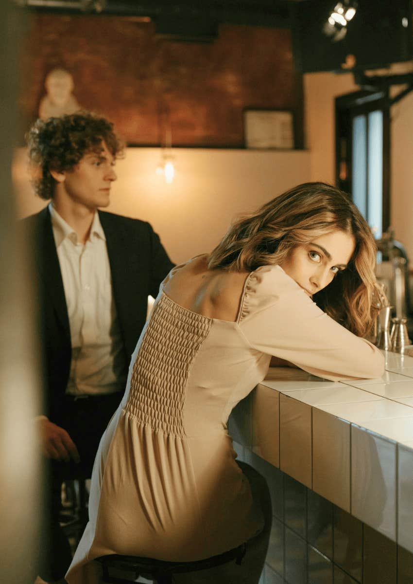 uncomfortable woman on a date with a delusional alpha male