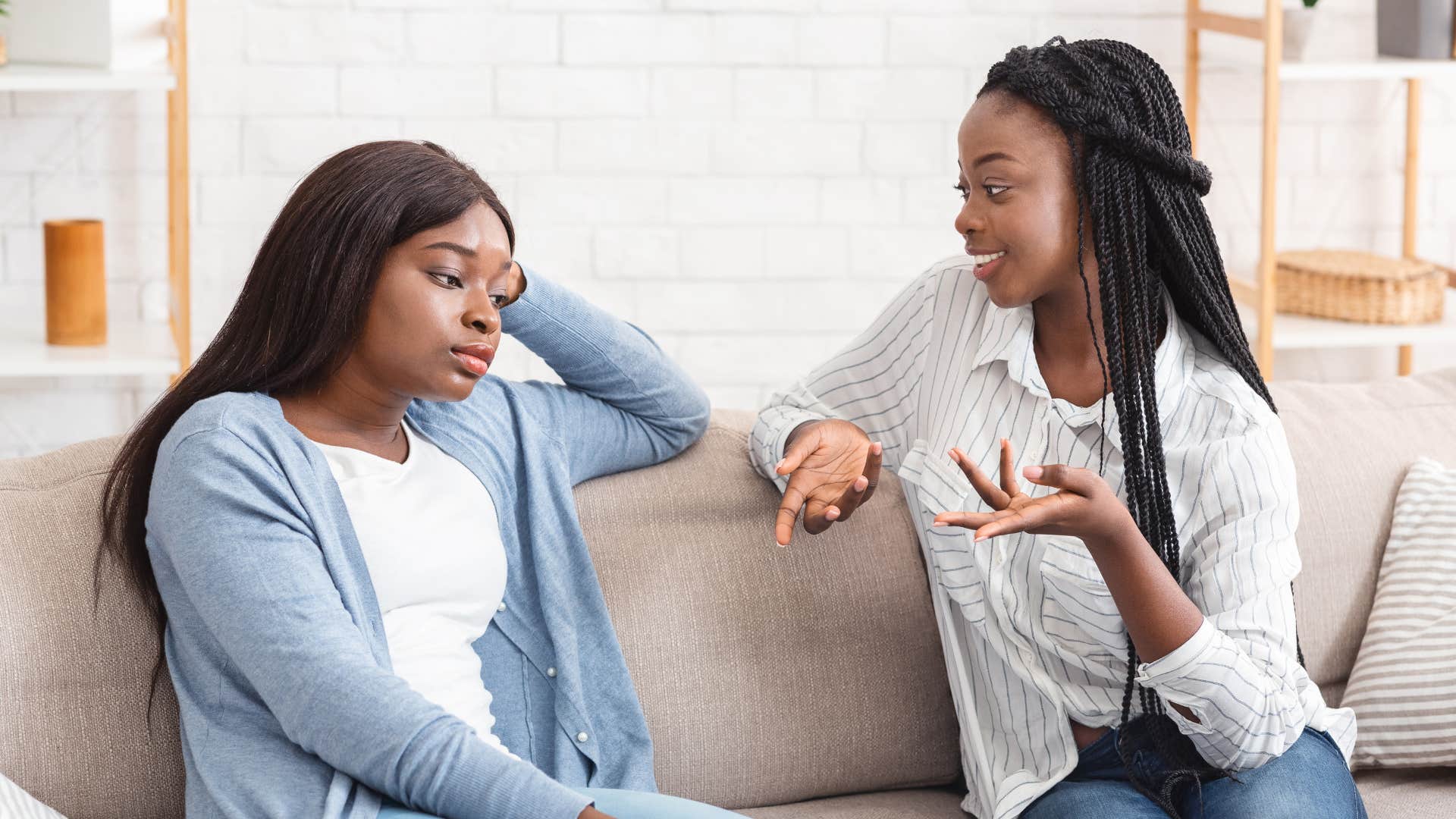 woman talking to friend who violated agreements with her