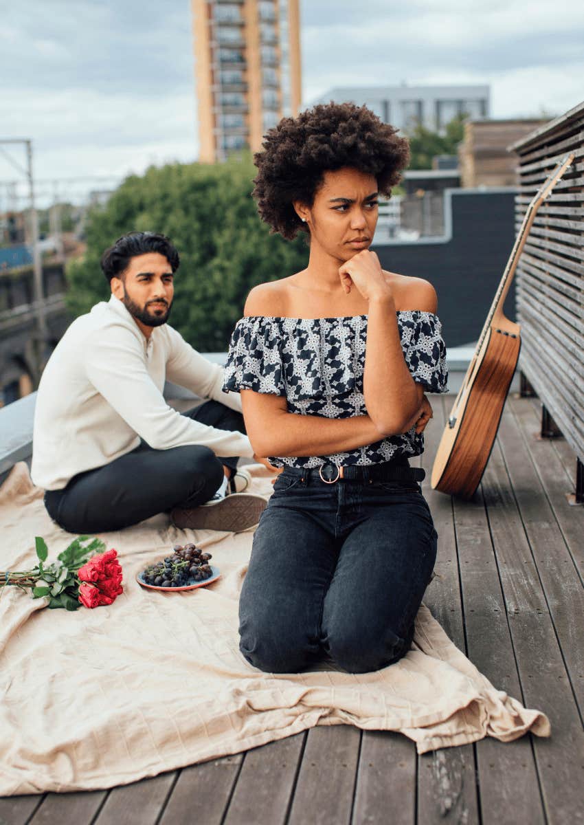 unhappy woman on a date with a man who wants a tradwife