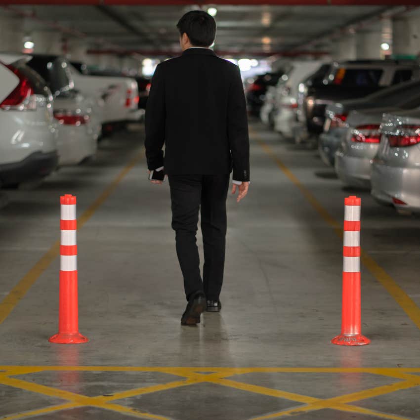 man who does not follow the unspoken rule of not walking down center aisle of parking lot