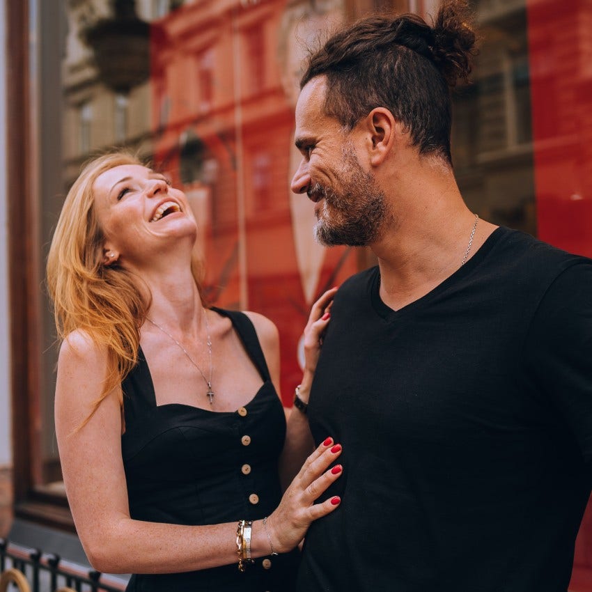 woman flirting with man by being touchy-feely