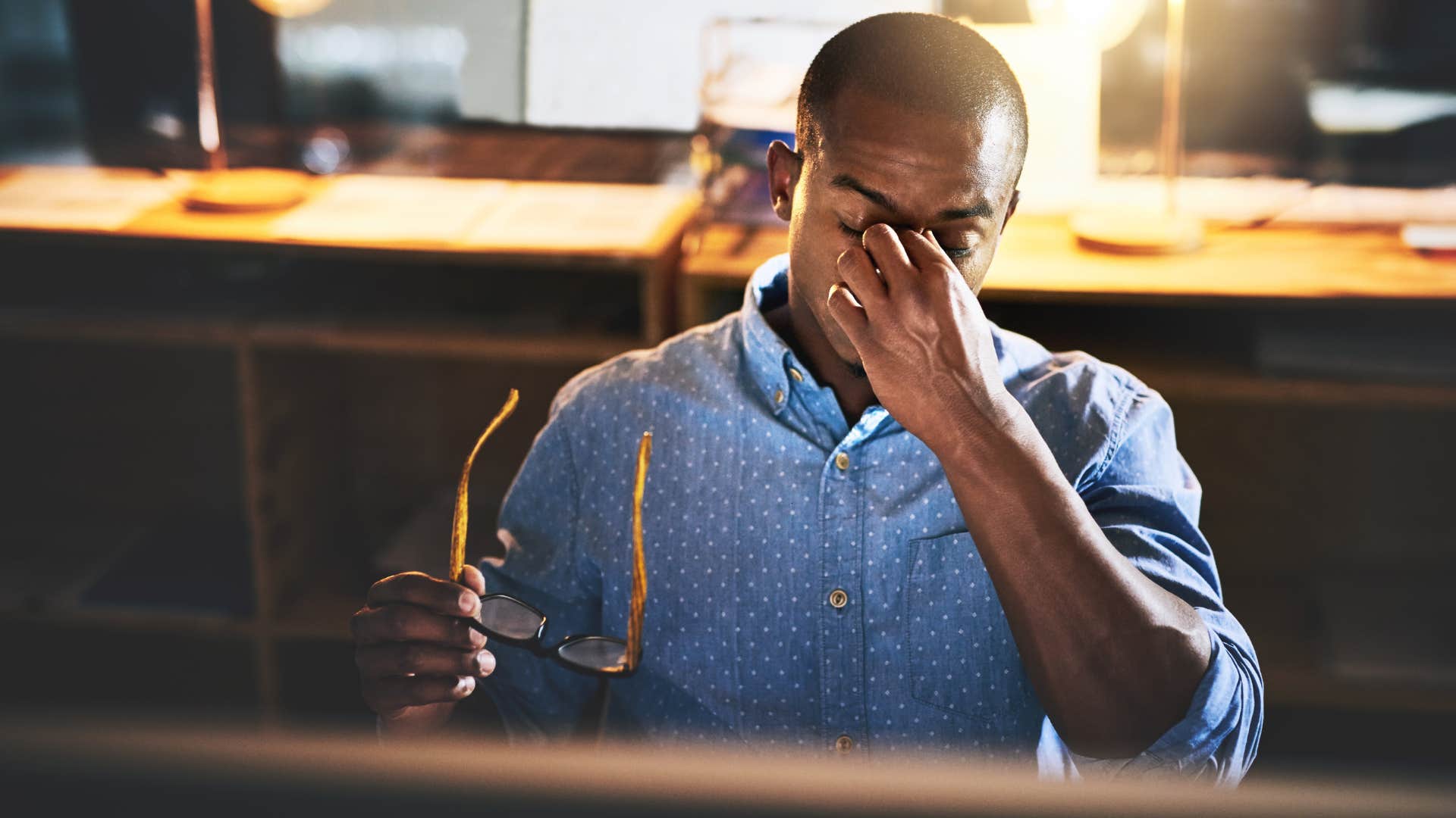 stressed man having trouble completing things on time at work